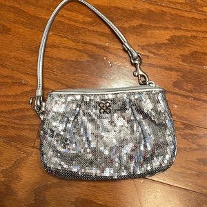 Silver sequence coach wristlet